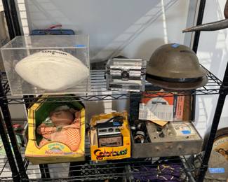 Vintage miliary helmets, cameras, and toys