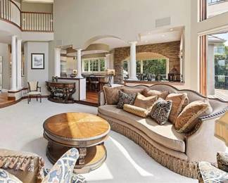 Lot 14: Elegant Curved Sofa w/ Tassel Skirt and Luxe Trim