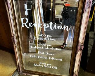 #200	large bevel mirror red and gold painted with wedding time vinyl on the front 32x45	 $75.00 			
