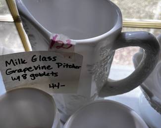 #123	Milk Glass Grapewine Pitcher and 8 Goblets	 $44.00 			
