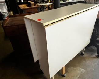 #173	laminate sewing table drop side on wheels 36x12-72x35	 $45.00 			
