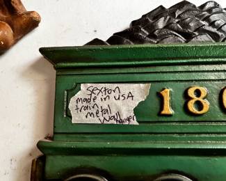 #149	Sexton made in USA metal wall hanger of a train	 $25.00 			
