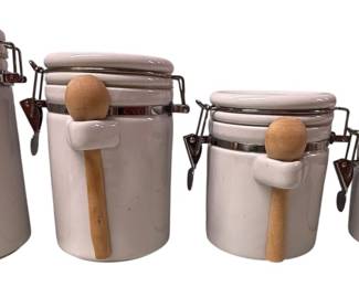 Four White Porcelain Canisters 