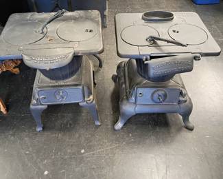 two large cast iron stoves in great condition