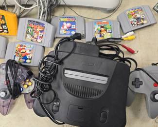 vintage Nintendo 64 with games and controllers