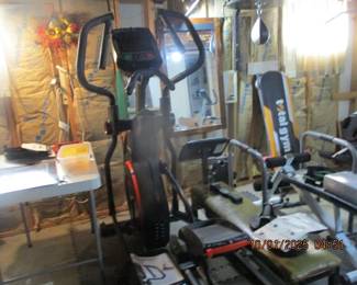 Lots of exercise equipment - Bowflex Elliptical machine