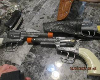 Vintage toy metal pistols and holsters