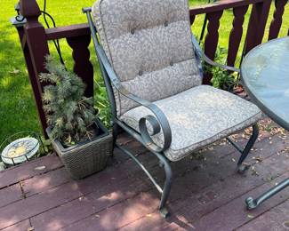 There are 4 of these with cushions that match the round, glass outdoor dinnng table.