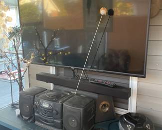 Several boom boxes, speakers and electronics