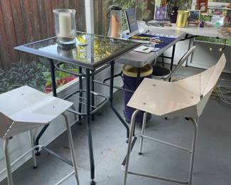 Tall glass top table , modern metal chairs