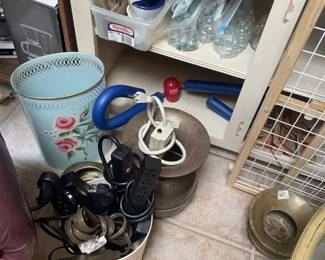Extension cords, brass planters, trash can