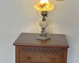 That's a nice lamp, sitting on the side cabinet.