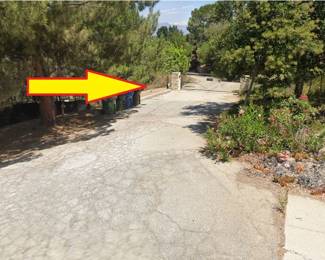 Enter through this gate at the intersection of Karen Sue Lane and Waldorf Road.  The sale is located down a long U-shaped driveway.  SOME parking is available on this driveway as long as there is space for other cars to pass.  