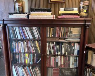 The obvious in this photo is the bookcase, but notice also the two bottles and the framed artwork.