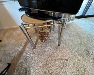 There are a pair of these chrome tables, very small.