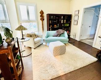 Neutral carpet, Soft blue settee, Mission bookcases, MCM art, Benjamin Chee Chee originals, TV, TV stand, curio cabinet, pottery....BOOKS