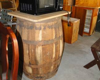 Vintage barrel, butcher block cutting board and working microwave