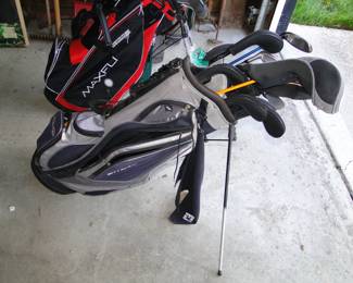Both golf bags are new, as are the clubs