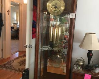 Large Grandfather clock with glass shelves inside. 