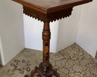 Antique marquetry chess/checkerboard table opens to compartment with onyx chess pieces.
