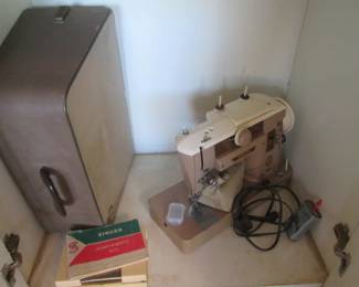 Singer Sewing Machine in Case, Fabric Remnants & Pattern Cutting Board