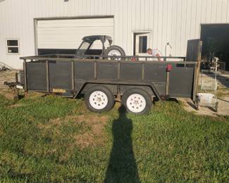 Trailer with ramp and tool box.