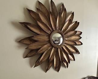 Midcentury Sunburst Tole Mirror with sunflower design.