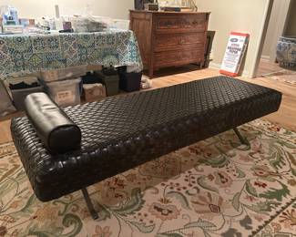 Woven Italian Leather day bed on chrome legs atop a 6' x 8'.9"  Portuguese crewel needlepoint rug. 