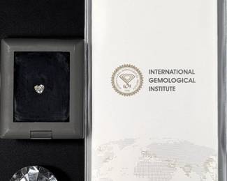 A Brilliant 1.01 CT Heart E VS1 Loose LAB GROWN Diamond In A Display Case With Diamond Report