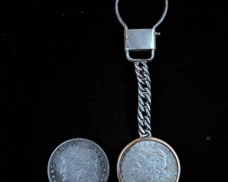1884 And 1921 Morgan Silver Dollars