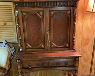 Great burled walnut Jacobean Cabinet. On top you'll see some 1st editions by Stephen King.