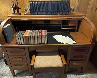 Amazing roll top desk. Lots of leather bound books for staging decor.