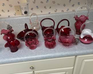 Red, cranberry and rose colored Fenton pieces. Many signed by George and Don Fenton.