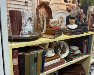 vintage books, religious pieces, tea cups and saucers
