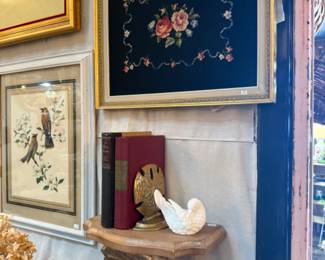 needlepoint art, framed bird prints, shell shelf and sand dollar brass bookends, white bird