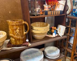 pottery pitcher, bowls, dishwater, books