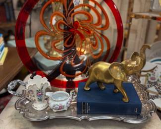 Brass elephant, small matching porcelain creamer and vase, beautiful silver butler's tray, vintage books and orange and red swirl bowl