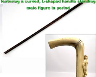 Lot 1888 Antique Carved walking stick cane featuring a curved, Lshaped handle standing male figure in period