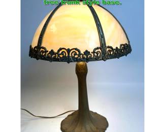 Lot 2151 Antique tan slag glass lamp with tree trunk style base. 