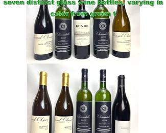 Lot 2390 10pcs Wine Bottles. A collection of seven distinct glass wine bottles, varying in color from green t