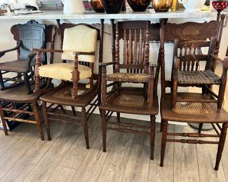 Lots of vintage wooden chairs