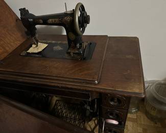 (2) antique Singer treadle sewing machines and cabinets.....
