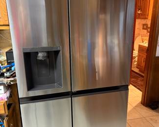 LG Practically new! 
27 cu. ft. Side-By-Side Refrigerator with Instaview Glass, Craft Ice, and Recessed Handles in PrintProof Stainless Steel