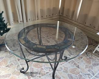 Round glass top table with tile insert
47" diameter
Metal base
$85