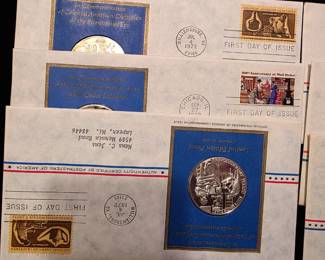 3 of more than 75 of these Sterling coins commerating first day issue stamps.