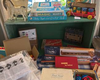 Walt Disney Trivial Pursuit, Dominos, and vintage wind up ladybugs. 