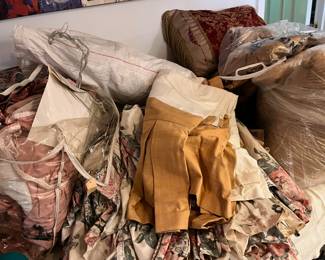 Tons of custom made curtains/drapes, bedding etc.