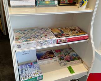 Puzzles on a functional shelving unit that needs a little TLC