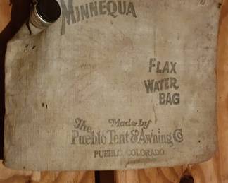 Vintage Minnequa Flax Water Bag, which was made by the Pueblo Tent & Awning Co. of Colorado. Used to keep water cool and were often hung on the outside of a vehicle.  