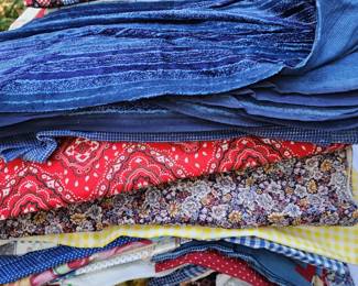 Stacks and totes of fabrics in this home!  If weather permits, we will have tables outside full of fabric items